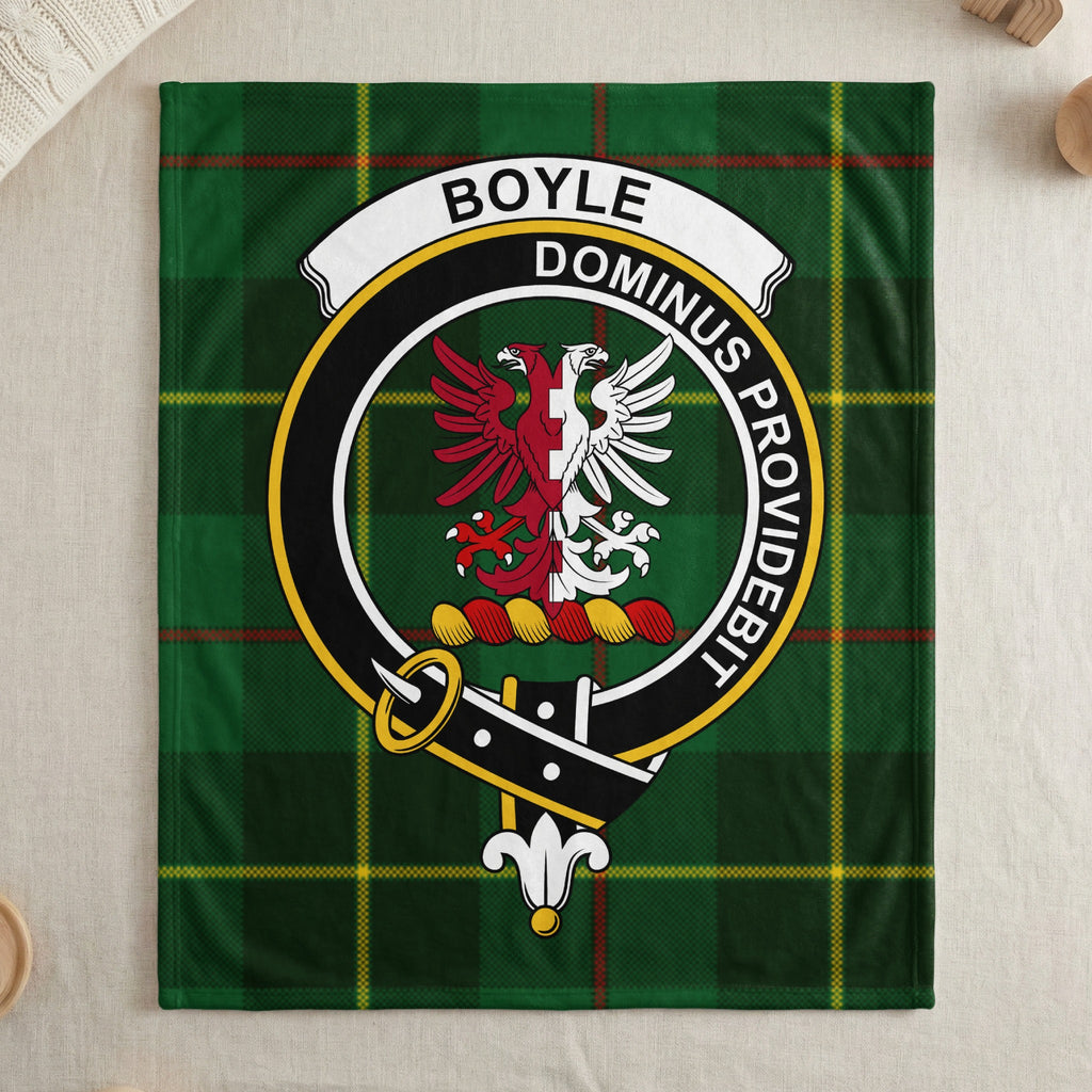 Boyle clan green tartan throw blanket with crest — draped display