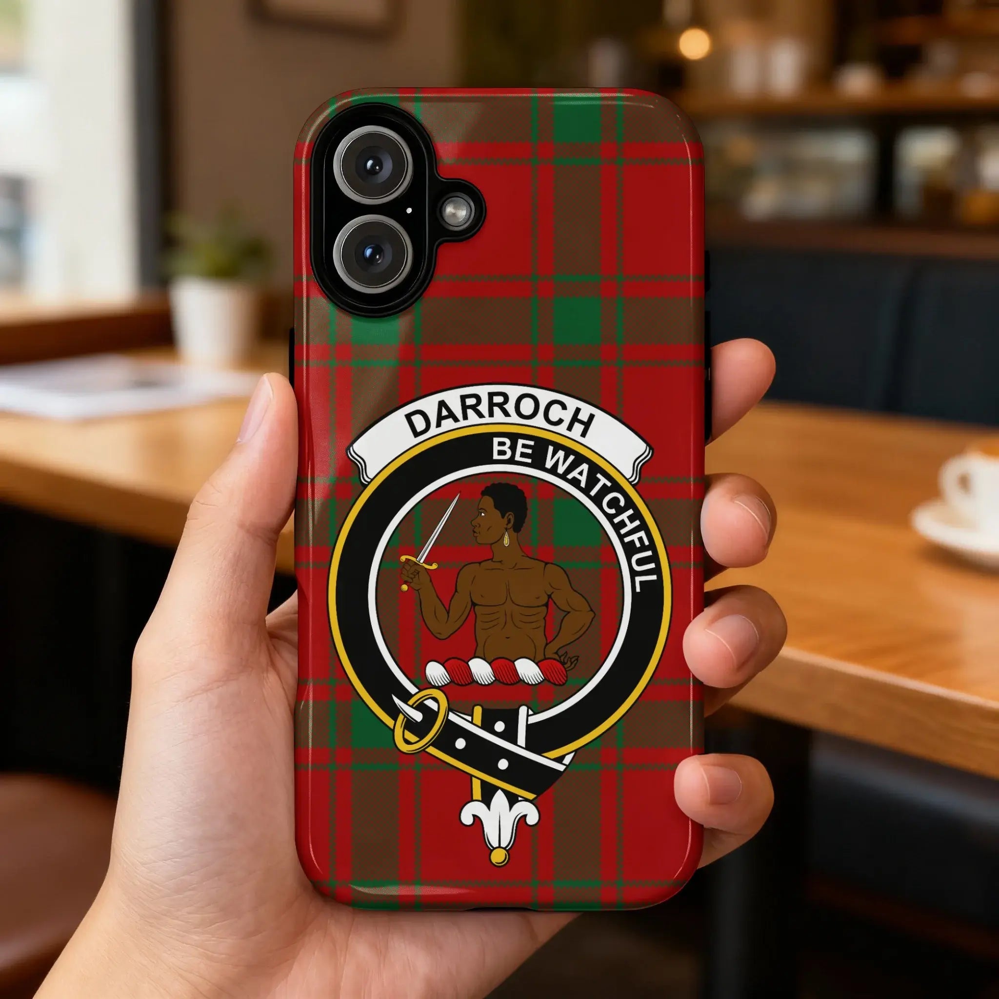 Clan Darroch tartan case on phone — slim glossy finish, crest detail visible, angled view