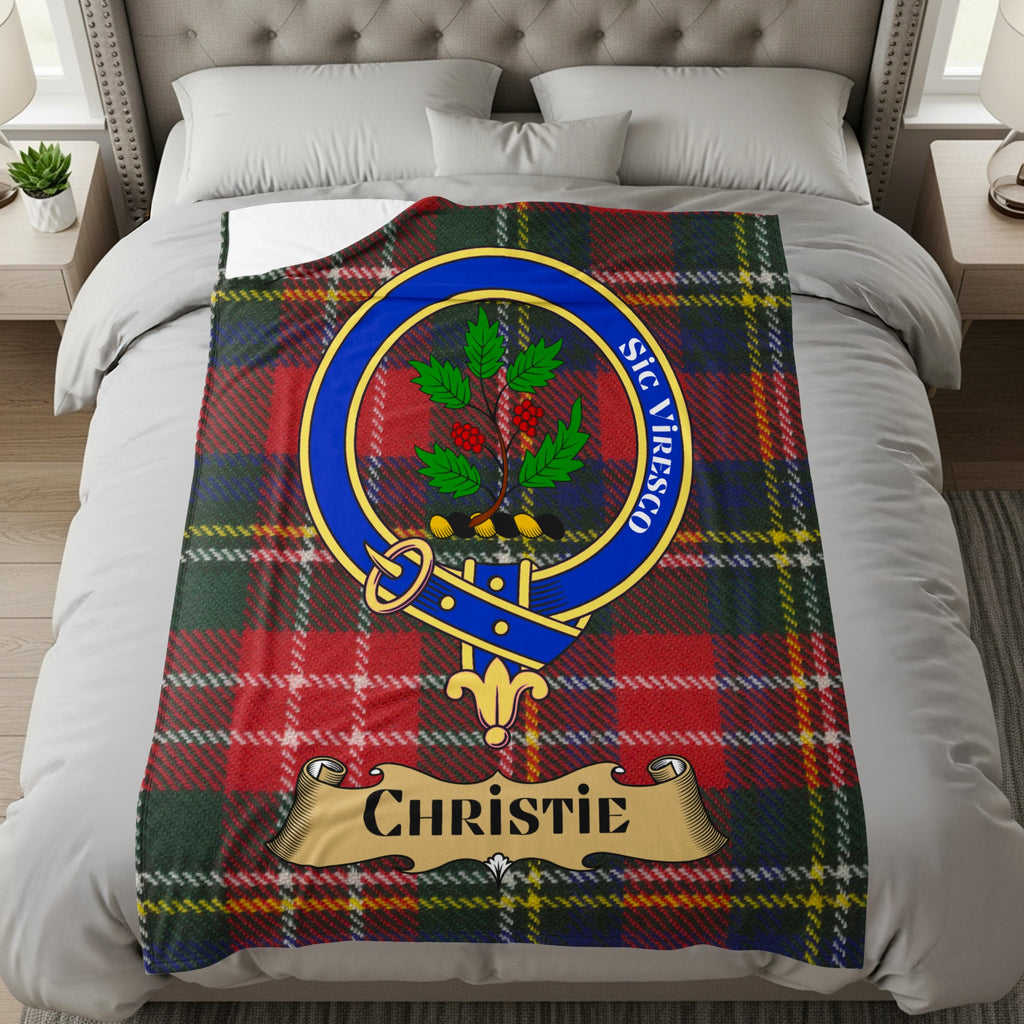 Christie clan crest with name scroll on red tartan throw blanket