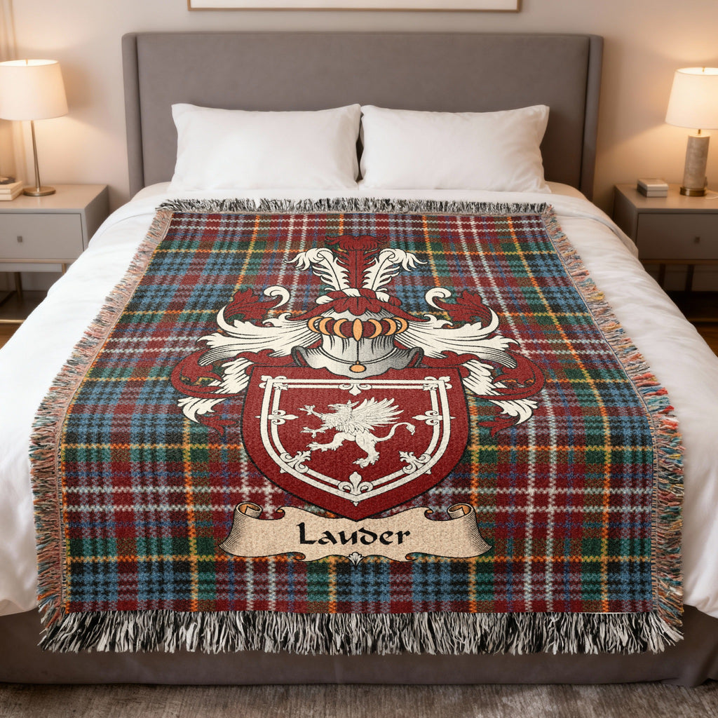 Lauder family crest emblem on a Caledonia tartan woven blanket