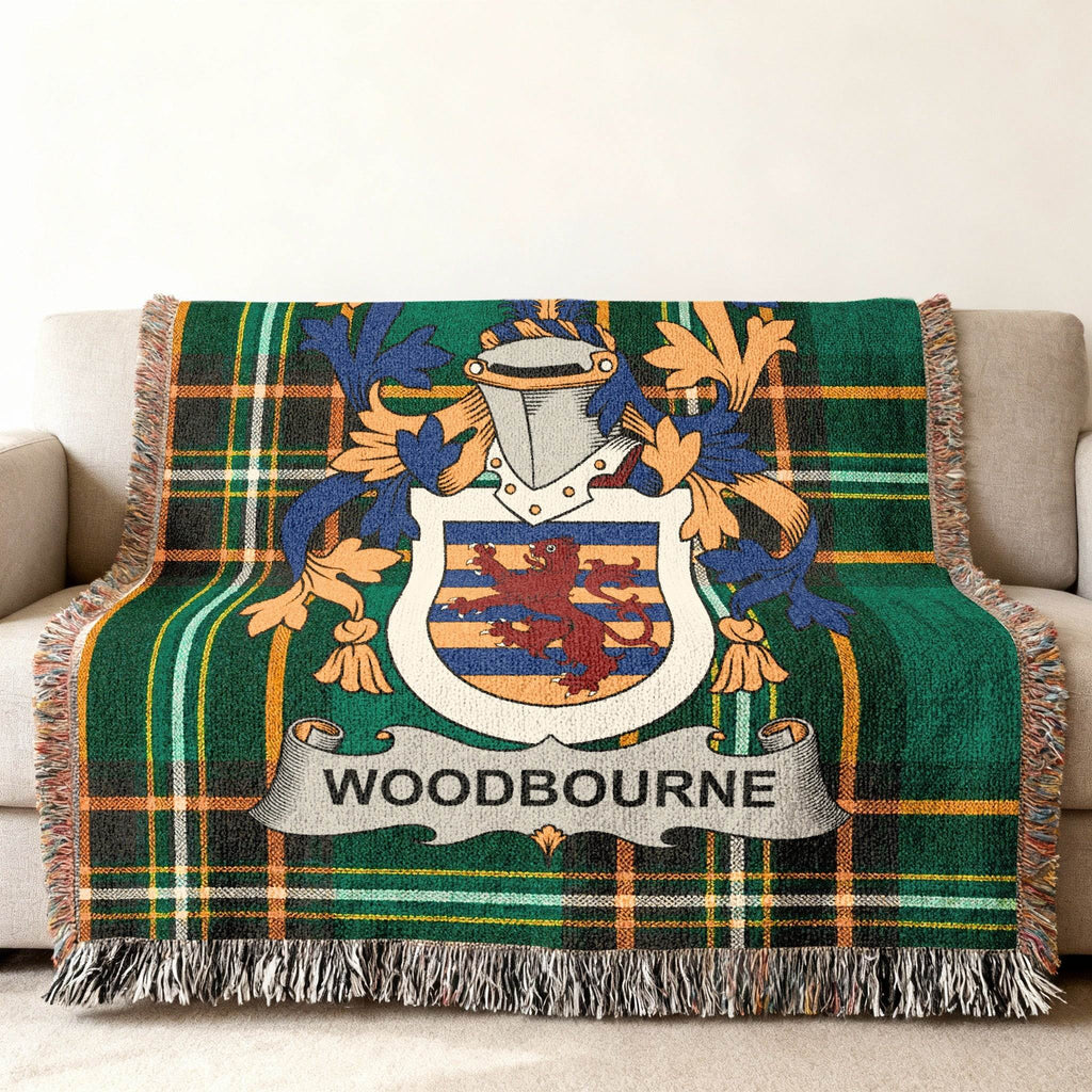 Green tartan throw blanket with Woodbourne family crest.