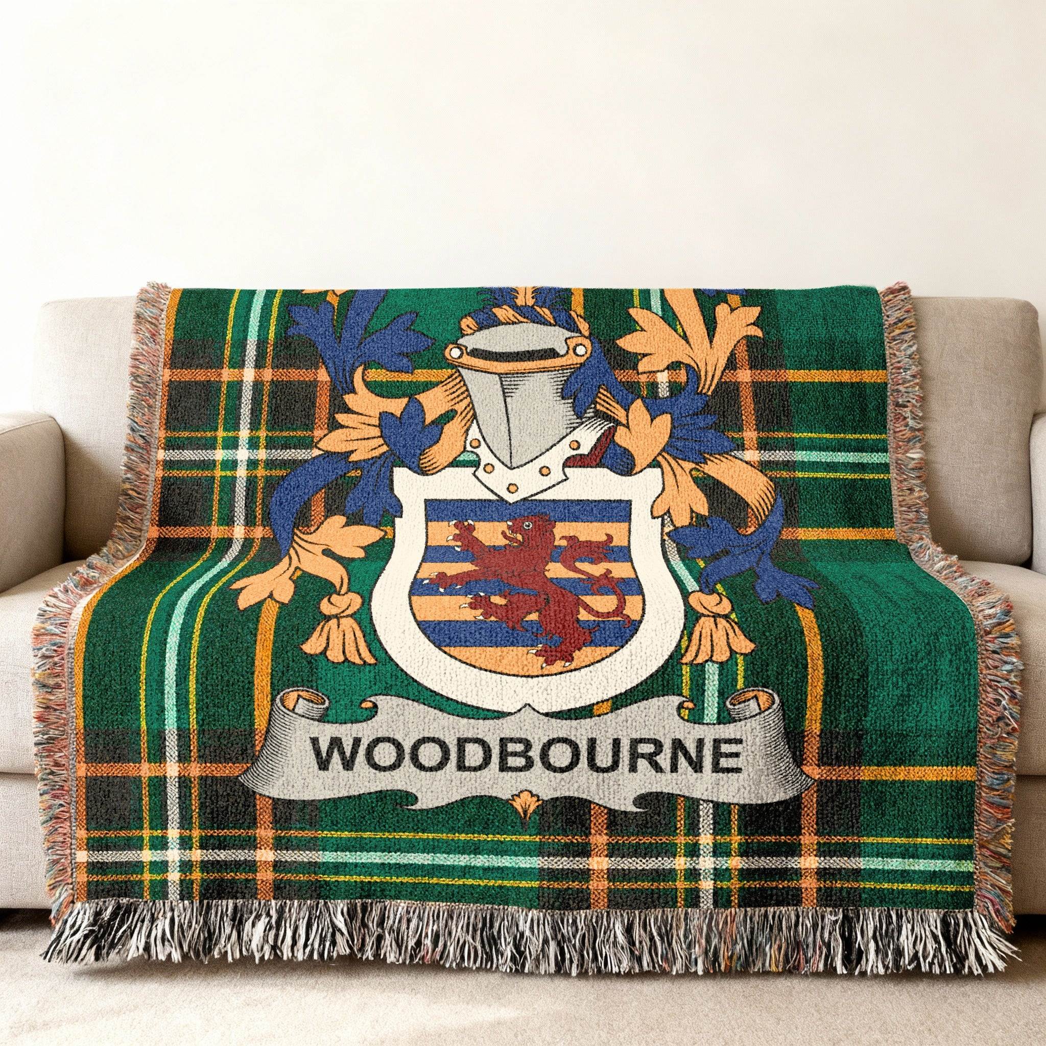 Green tartan throw blanket with Woodbourne family crest.