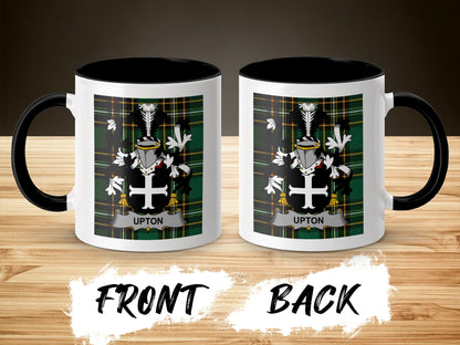 Two mugs displaying a coat of arms with the name "UPTON" on a green plaid background.