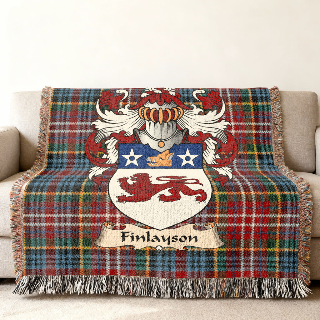 Finlayson family crest emblem on a Caledonia tartan woven blanket
