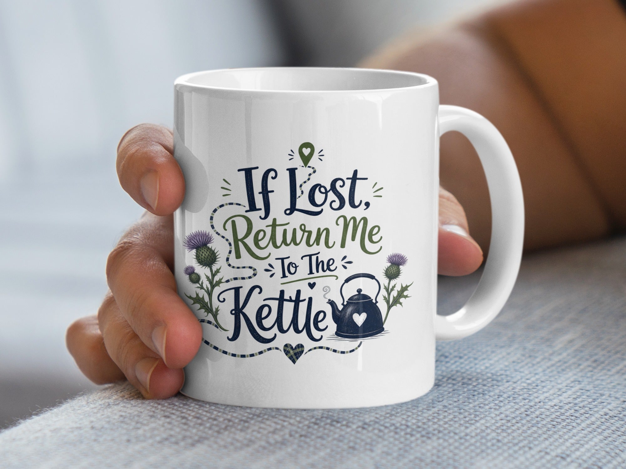 White mug with "If Lost, Return to the Kettle" and thistle graphic.