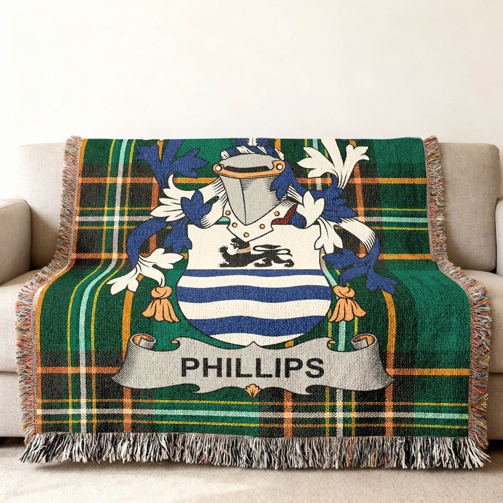 Phillips family crest on a green plaid woven blanket.