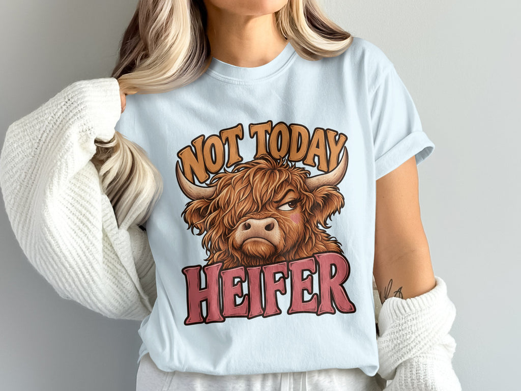 Model wearing the Not Today Heifer Highland cow Comfort Colors T-shirt in Chambray
