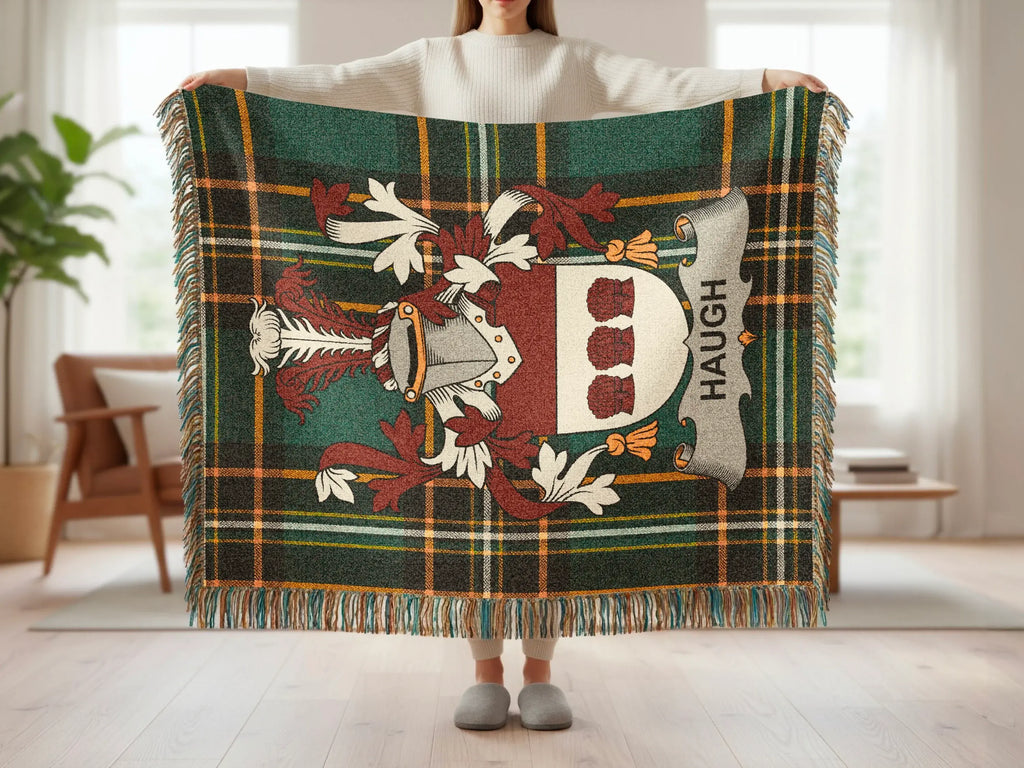 Tartan blanket with crest and "HAUGH" text.