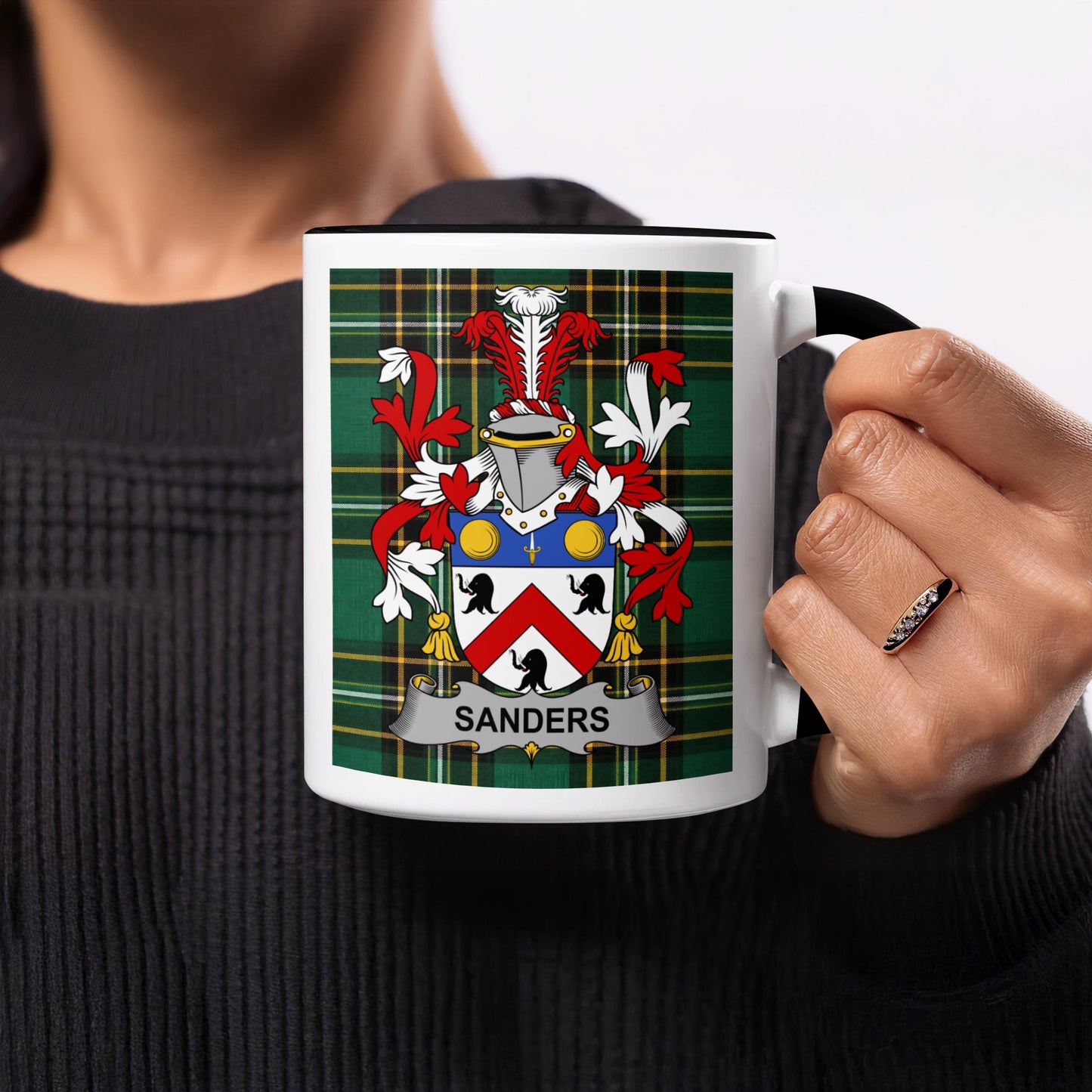 Sanders family crest on a mug, with green plaid background.