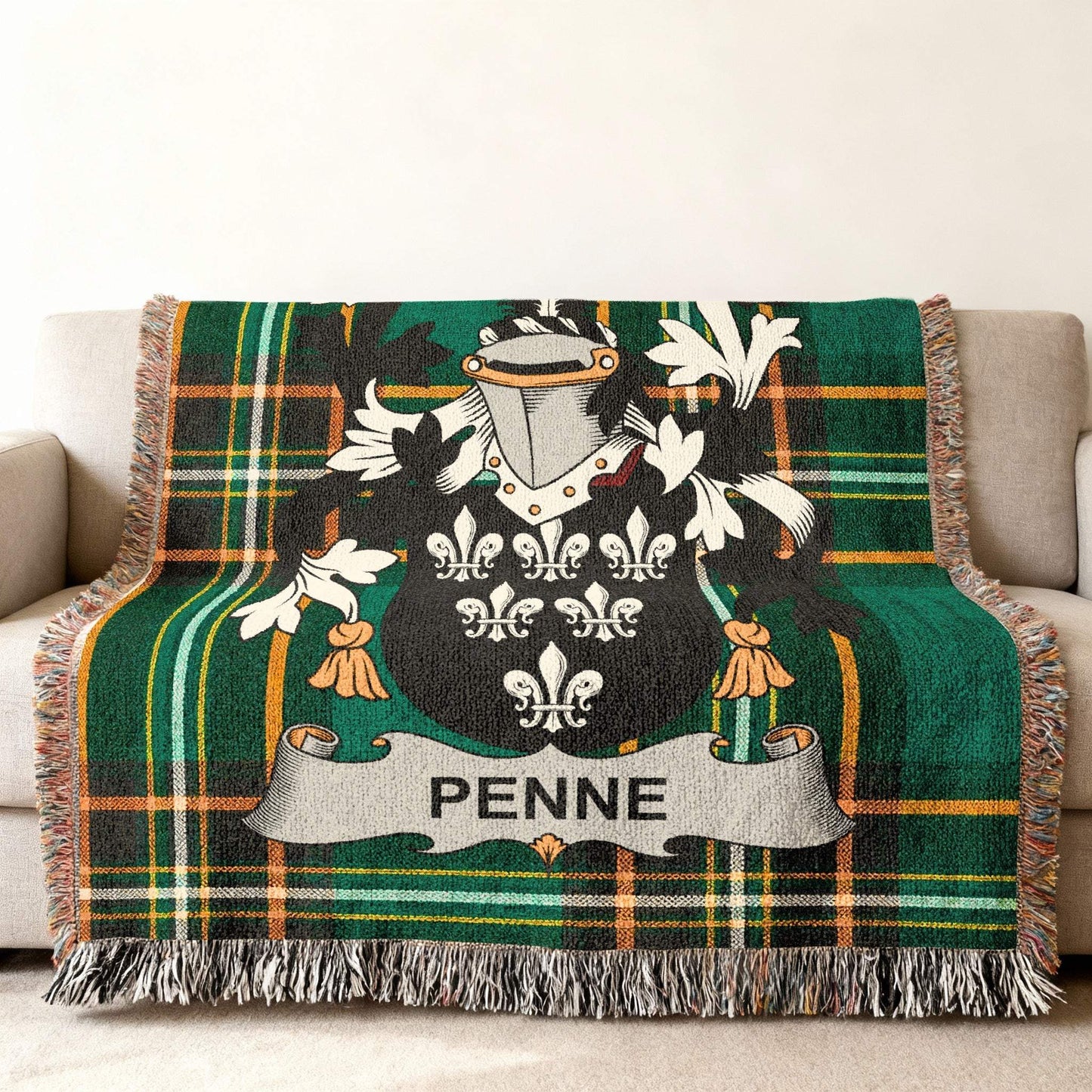 Green plaid blanket with Penne family crest in center.