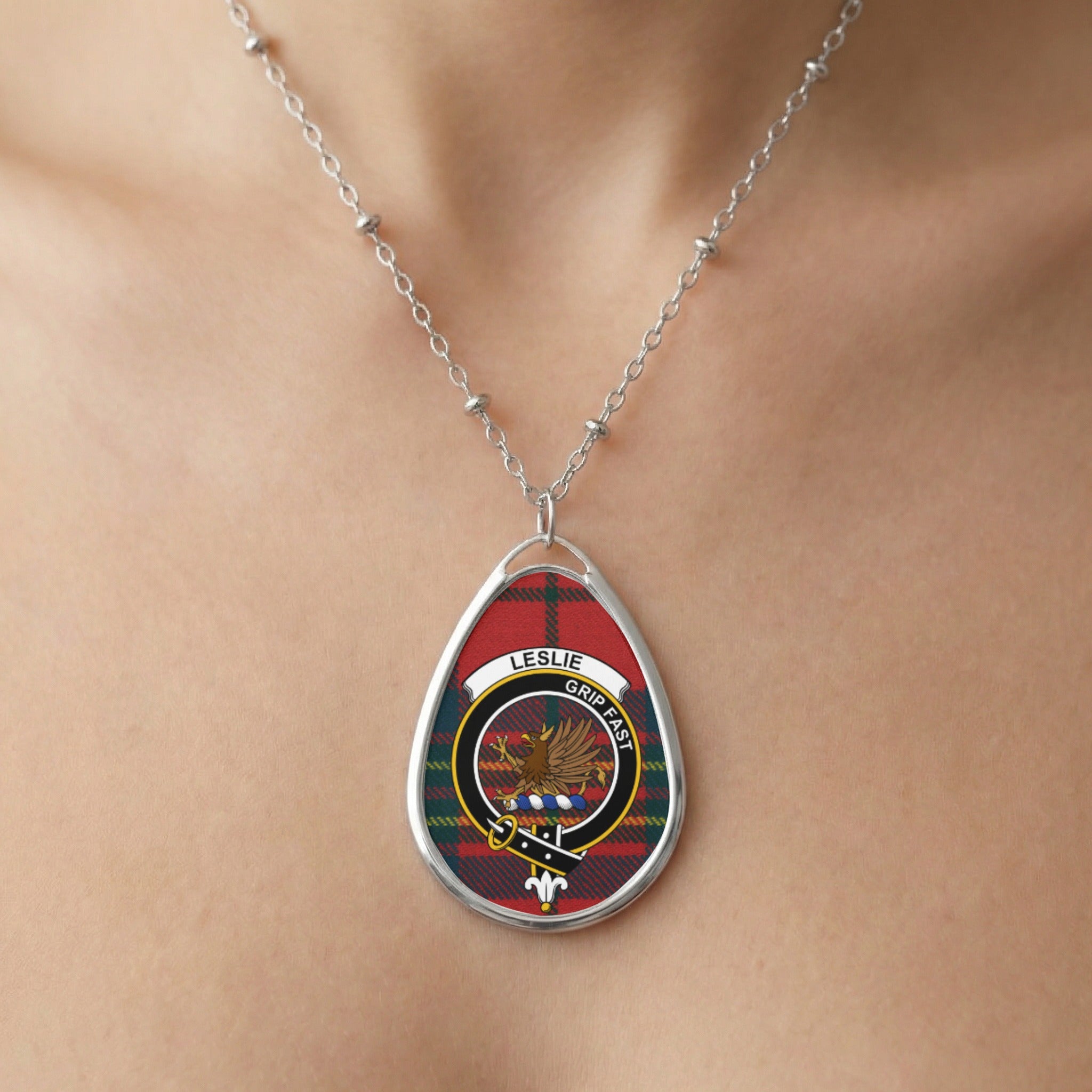 Close-up of Leslie clan tartan pendant necklace with crest design