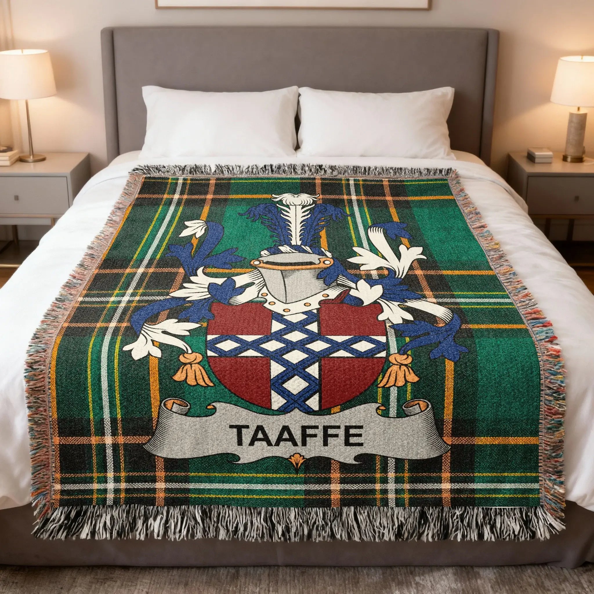 Taafe family crest on a green plaid woven blanket spread on a bed.