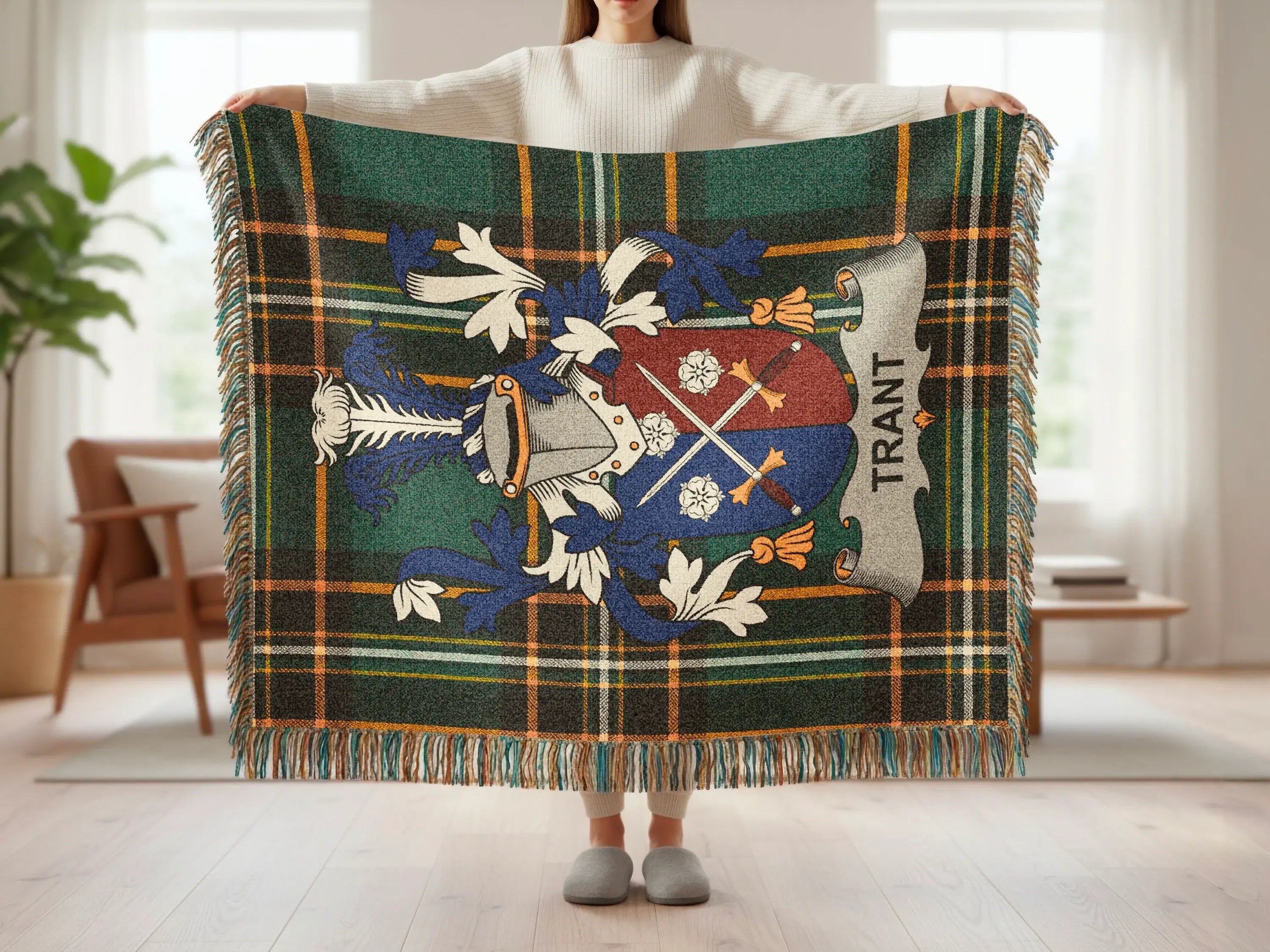 Tartan blanket with a heraldic crest and the name "TRANT".