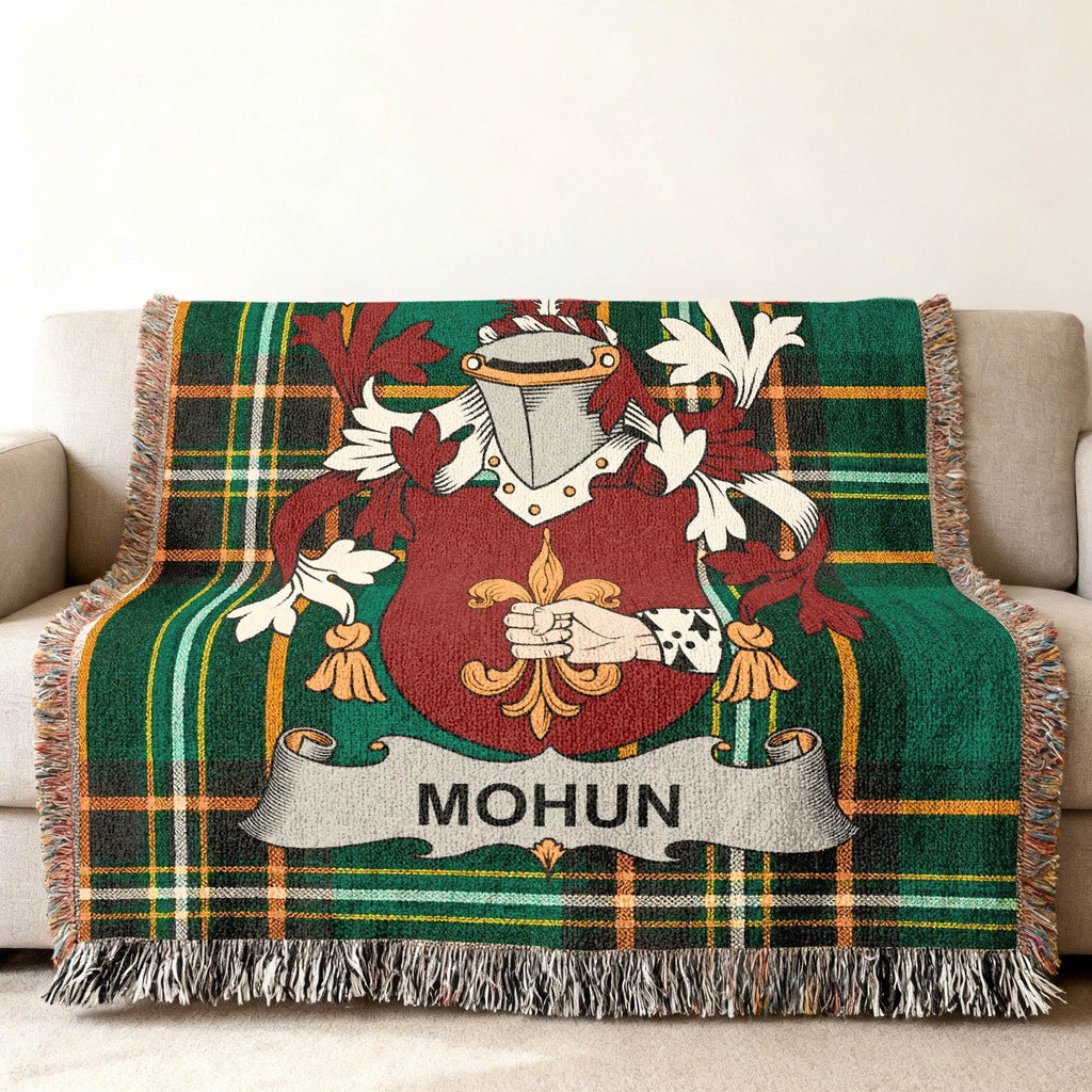 Green plaid blanket with a Mohun family crest.