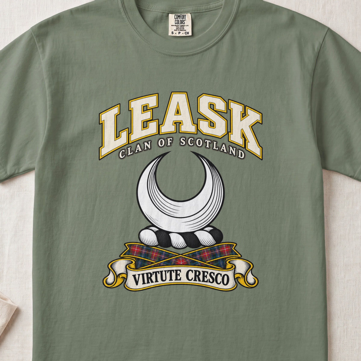 Leask Scottish clan T-shirt in Moss, front view with a silver crescent and motto design.
