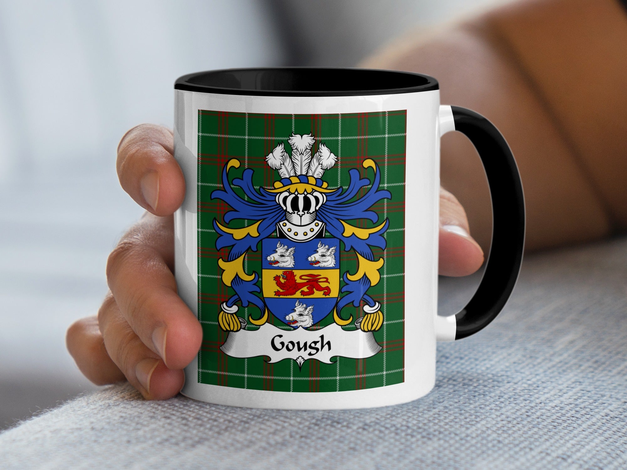 White mug with black handle featuring the Gough family crest on a tartan background.