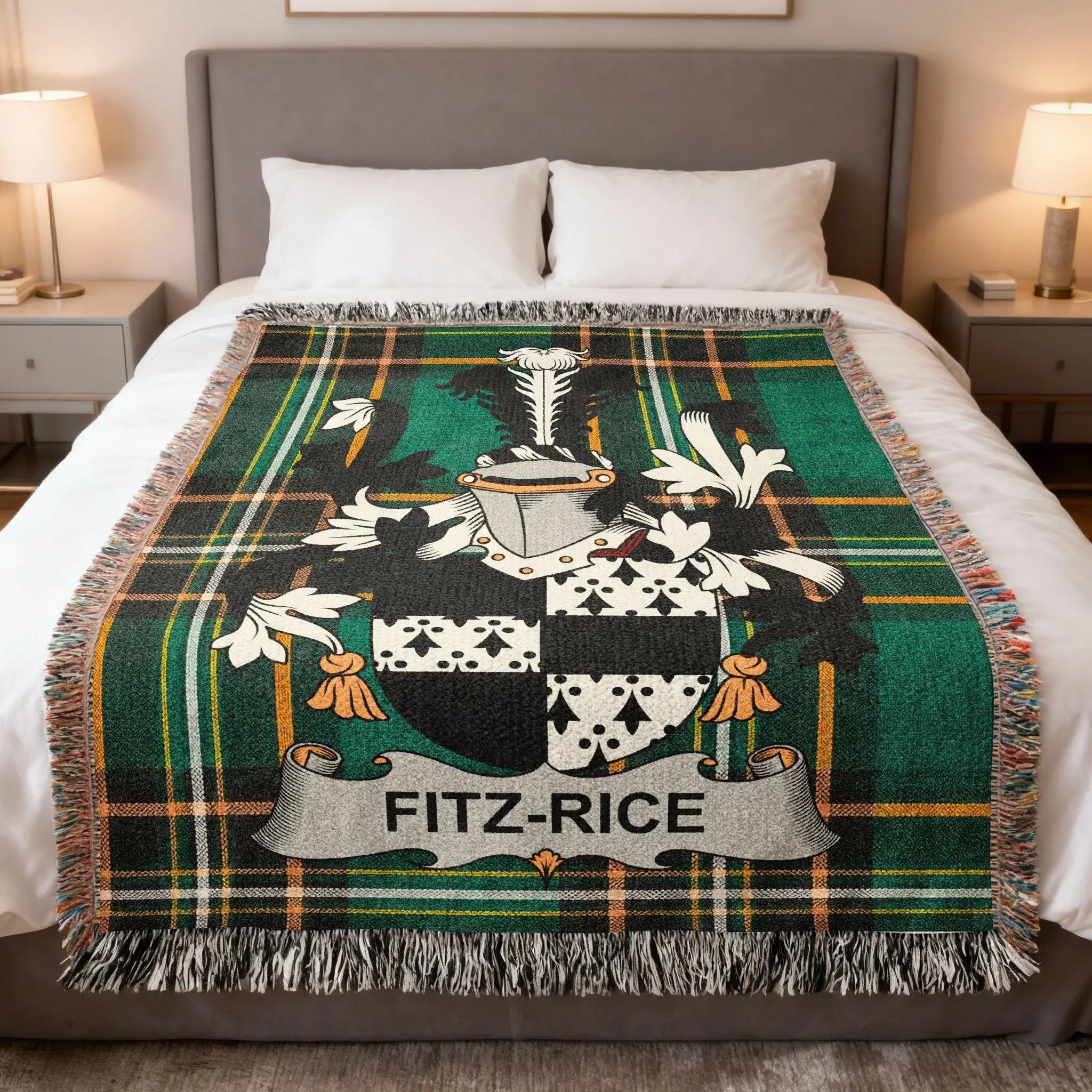 Fitz-Rice tartan blanket with coat of arms draped on a bed.