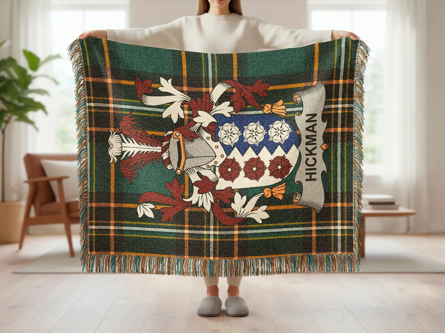 Green tartan throw blanket with Hickman family crest displayed.
