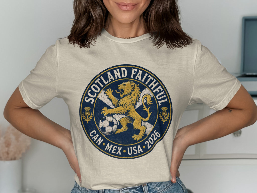 Cream t-shirt with Scotland Faithful Can Mex USA 2026 soccer crest.