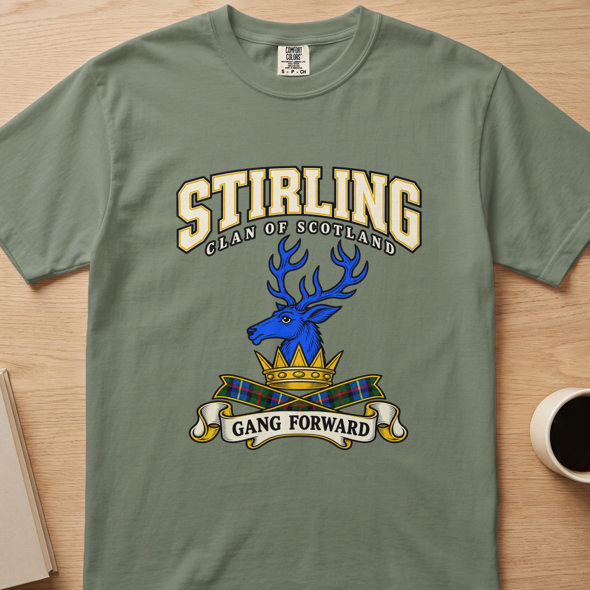 Stirling clan T-shirt in sage green, front view with blue stag head above a gold crown