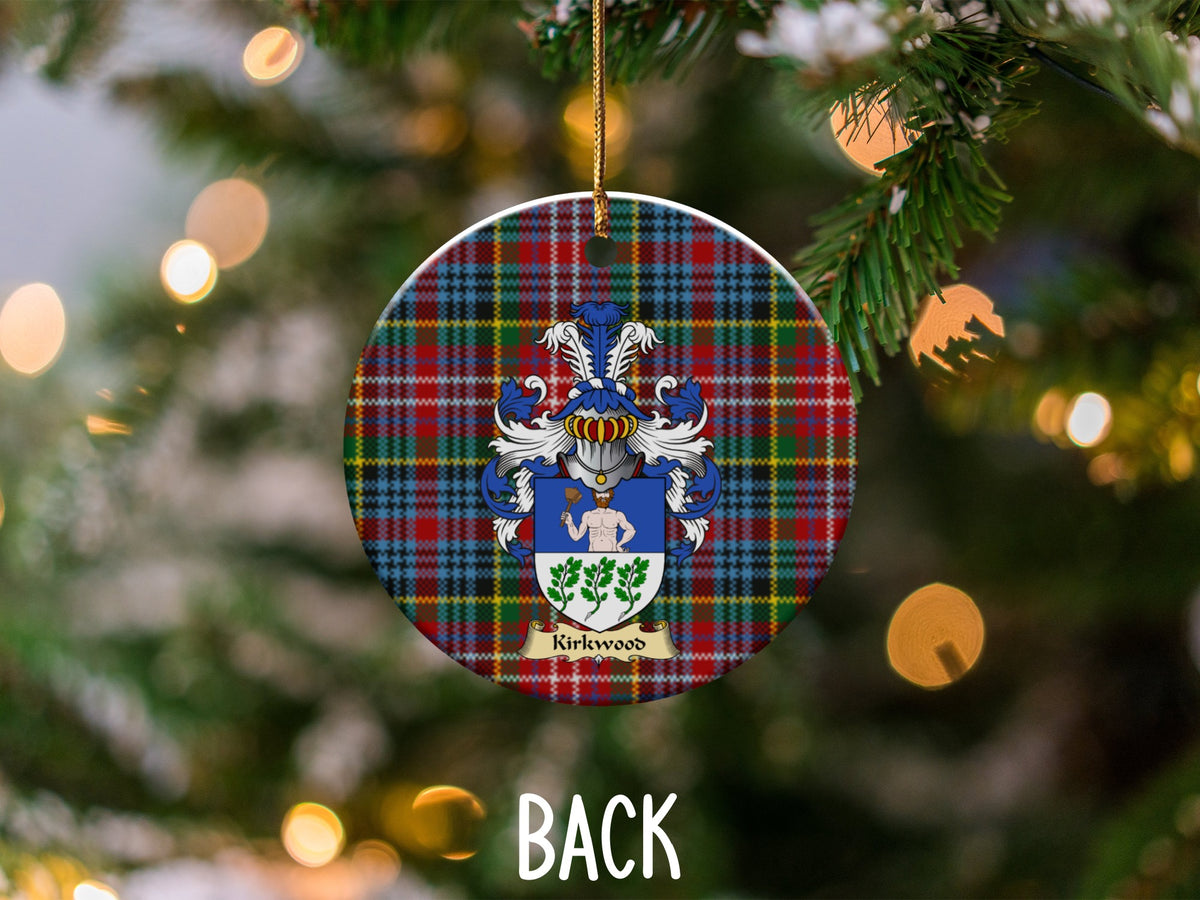 Kirkwood ceramic ornament detail showing a double-sided family shield on a Caledonia tartan background