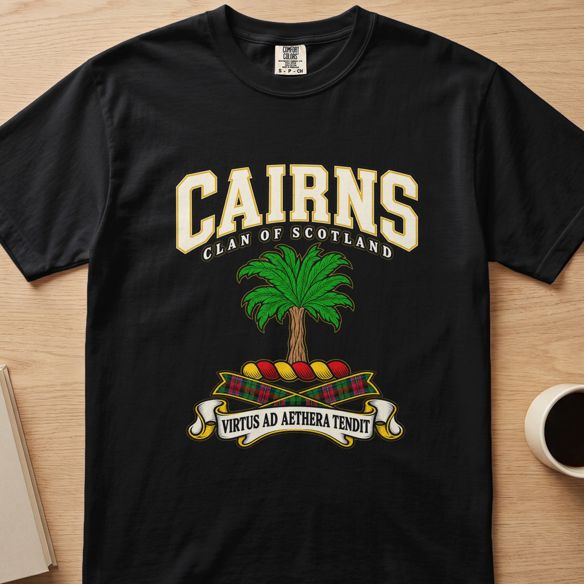 Cairns clan crest with green palm tree on a black Comfort Colors T-shirt, front view