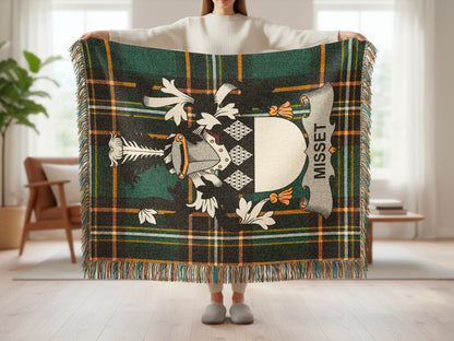 Tartan blanket with family crest and "MISSET" text.