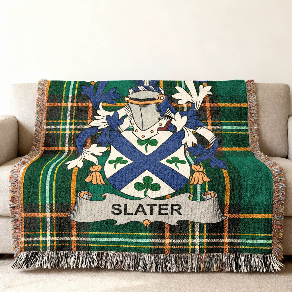 Green plaid throw blanket with Slater family crest.