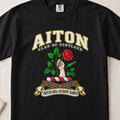 Aiton Scottish clan T-shirt in Black, front view with a hand holding a red rose with green leaves and motto design.