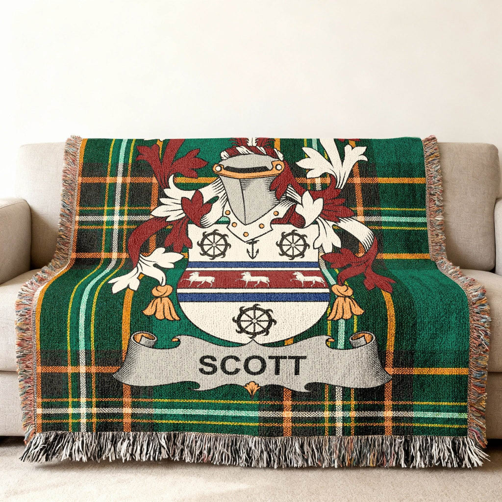 Tartan throw blanket featuring the Scott family crest with text.