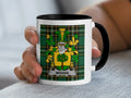 Mug with the Woods family crest on a plaid background.