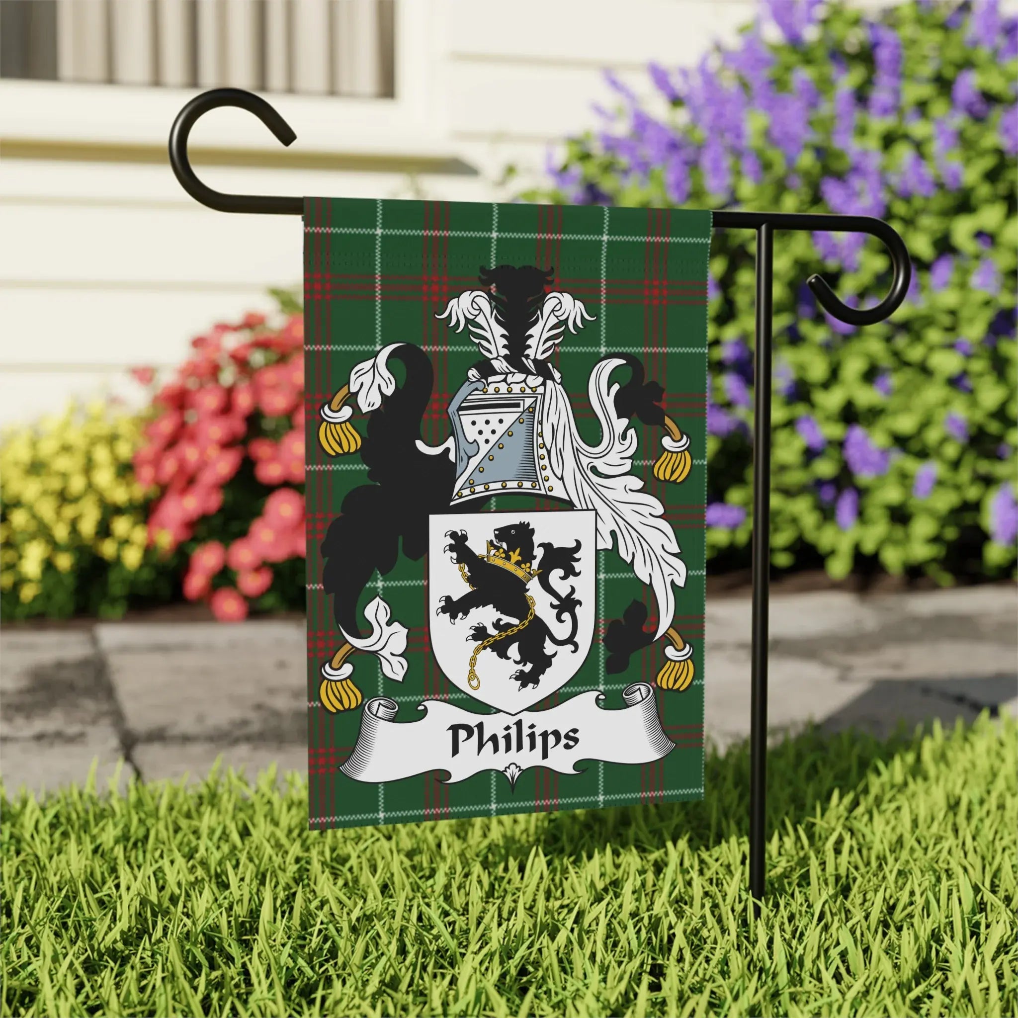 Green plaid flag with the Phillips family crest and name displayed.
