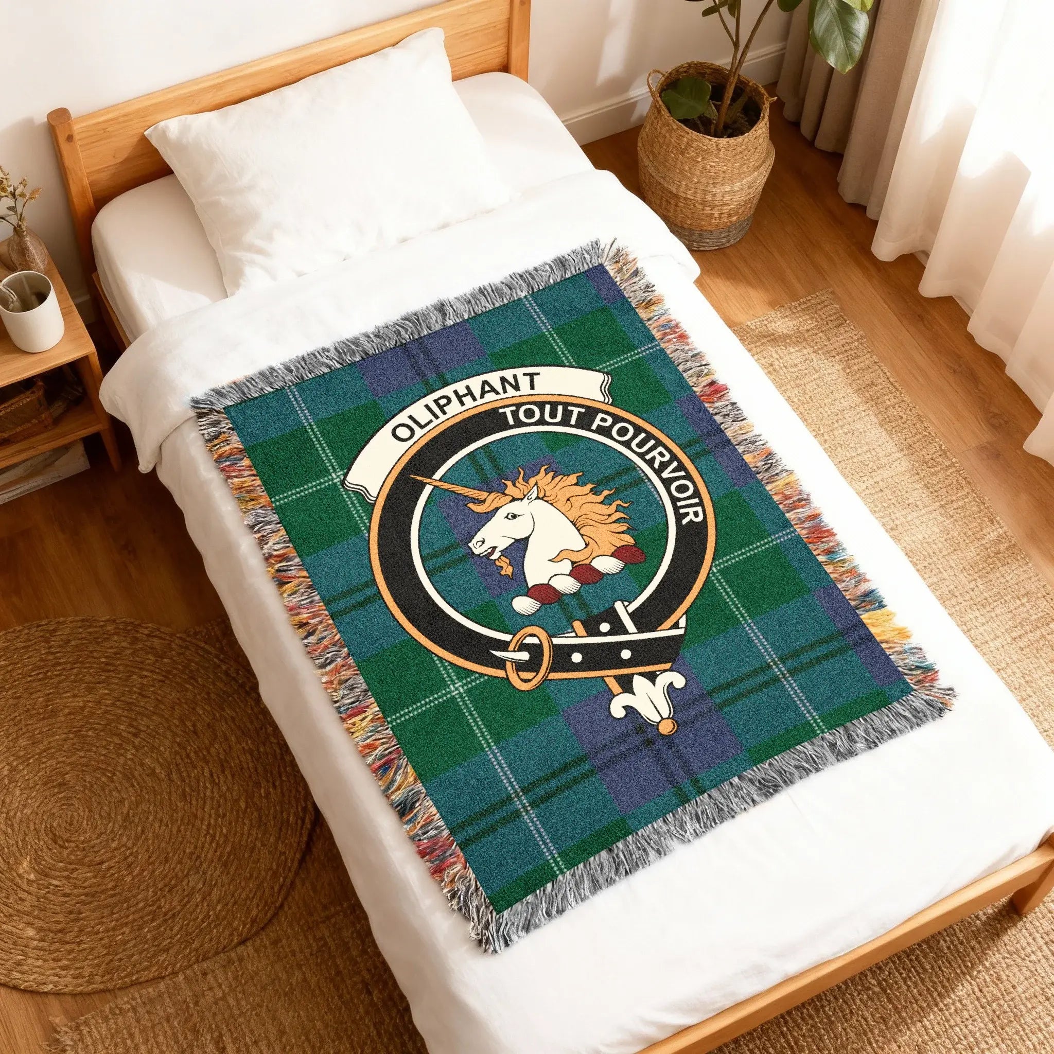 Close-up of Oliphant unicorn crest detail on woven cotton blanket