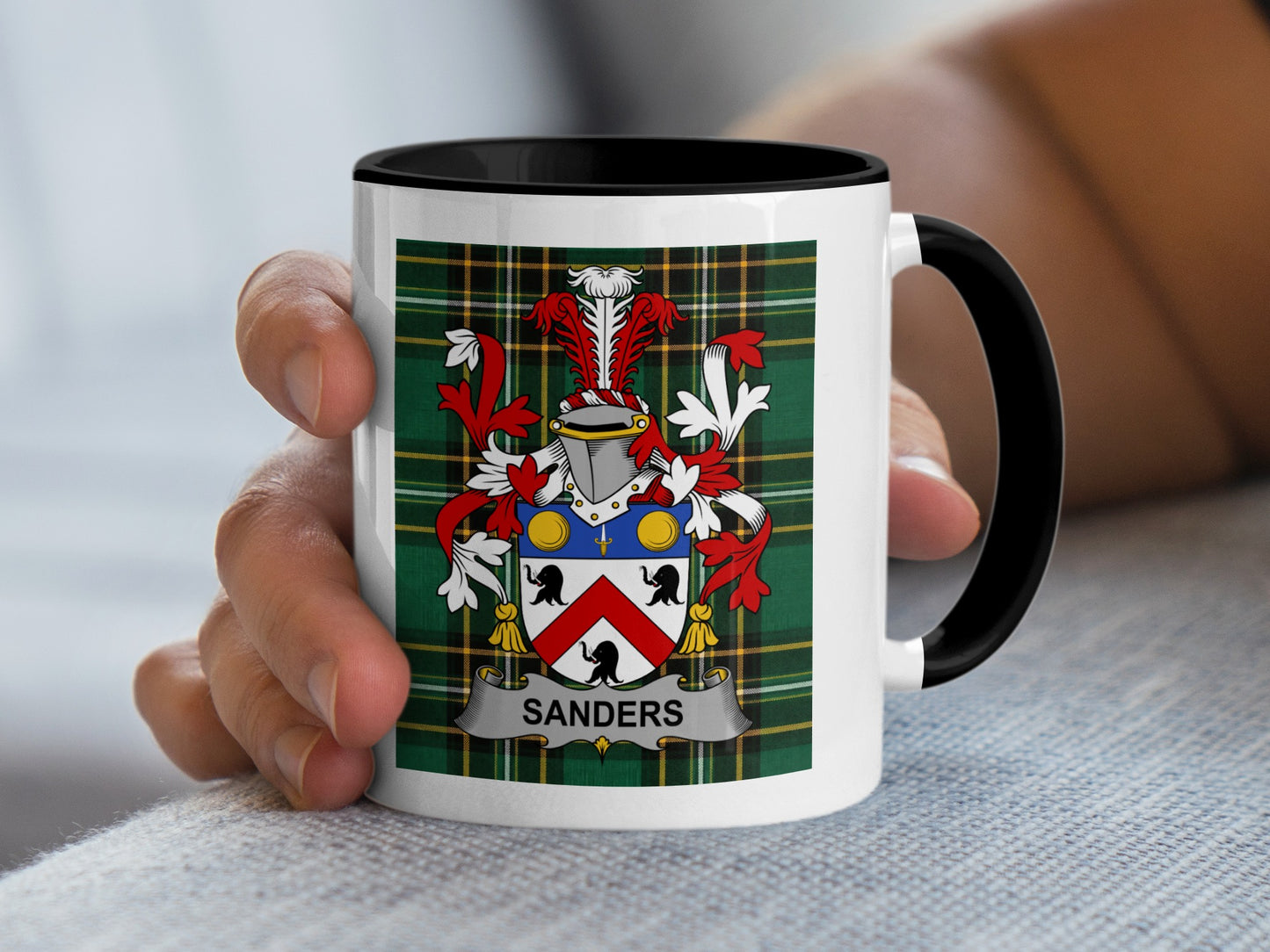 Mug with the Sanders coat of arms on a plaid background.
