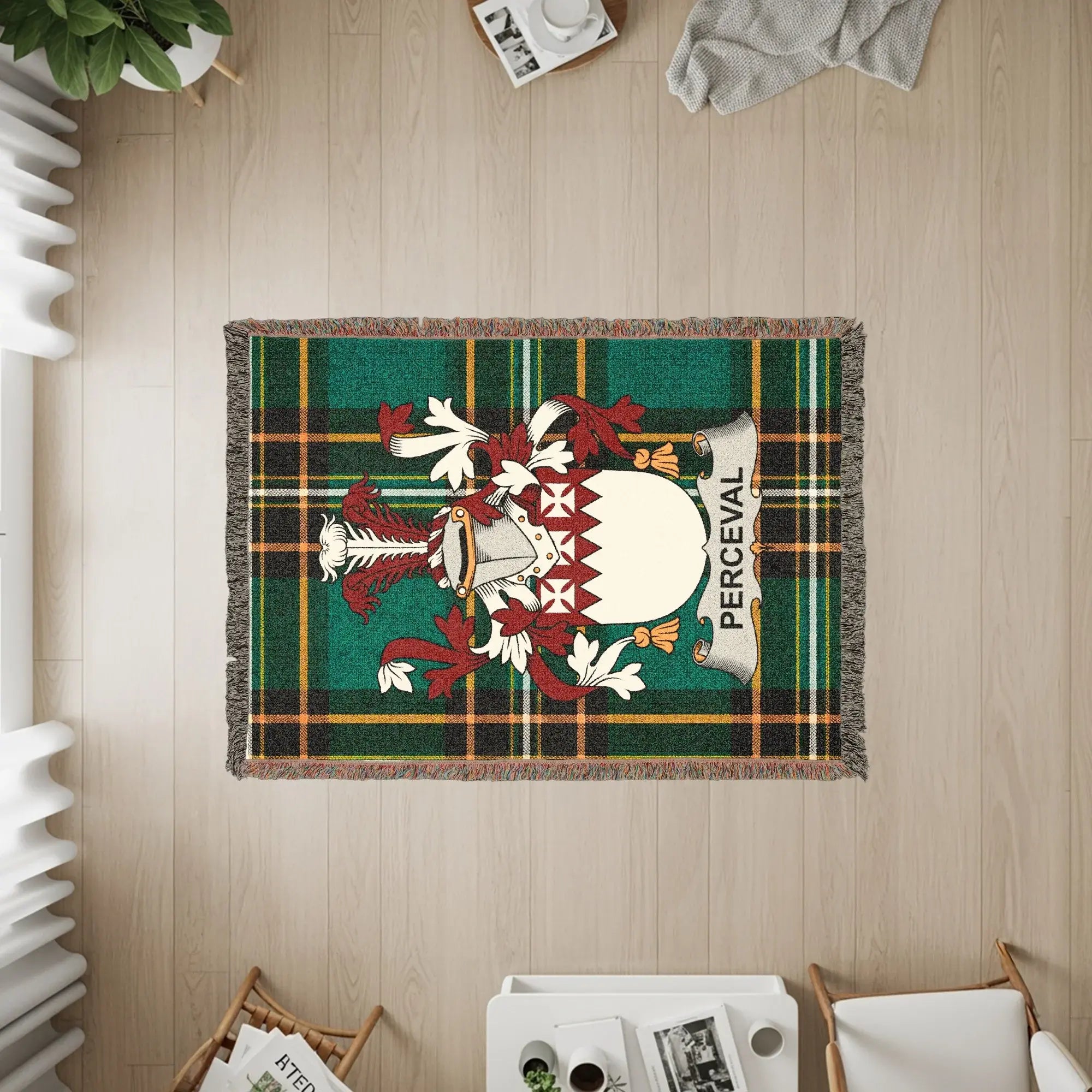 Woven blanket with green tartan plaid and a coat of arms with the name PERCEVAL.