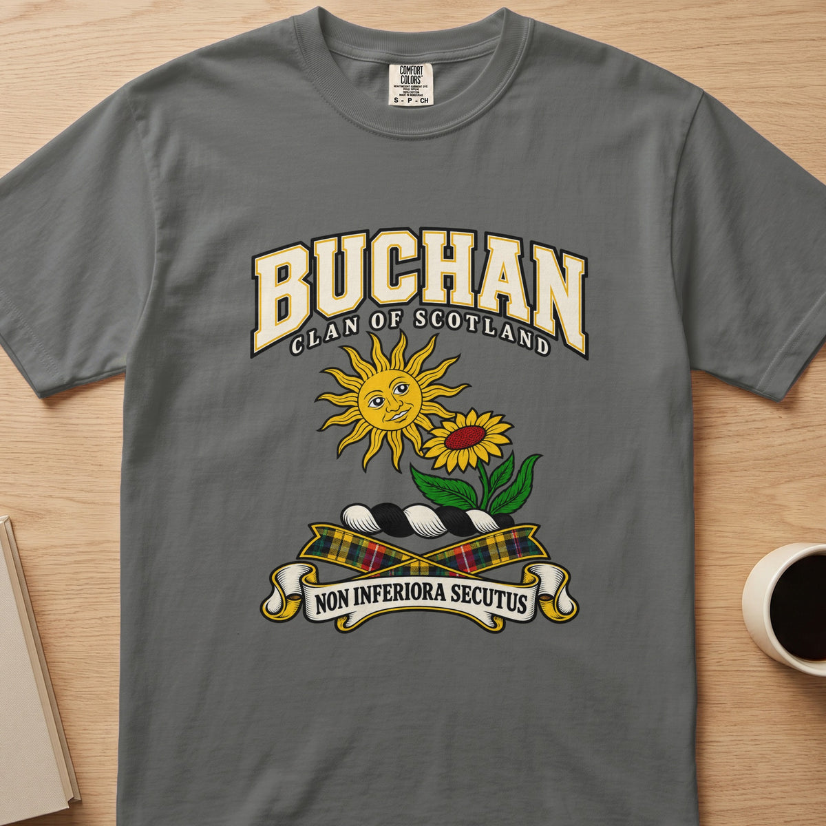 Buchan clan crest with sun and flower on a gray Comfort Colors T-shirt, front view