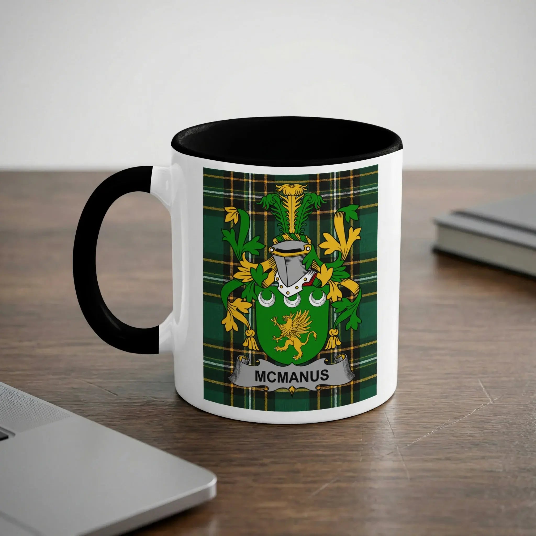 McManus Irish heritage mug with black handle and family crest