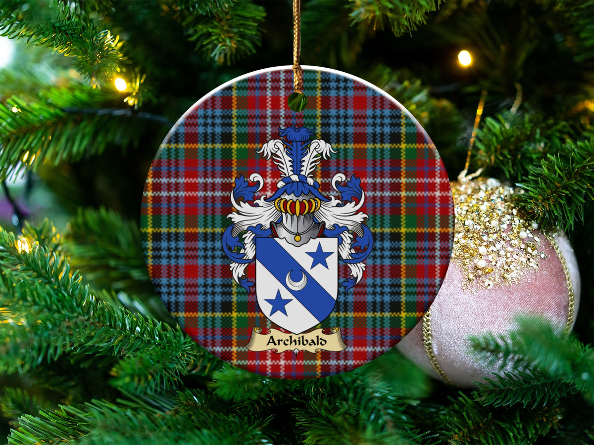 Archibald Scottish clan ceramic ornament with family crest on a Caledonia tartan background, hanging on a Christmas tree