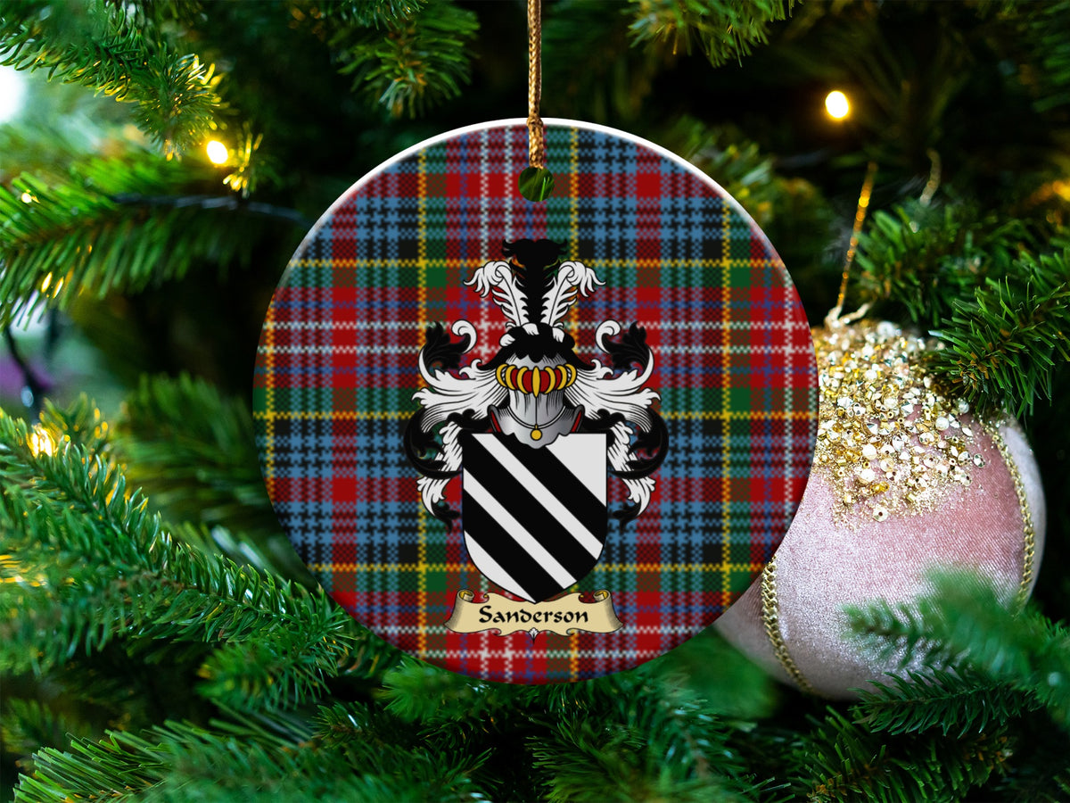 Sanderson Scottish clan ceramic ornament with family crest on a Caledonia tartan background, hanging on a Christmas tree