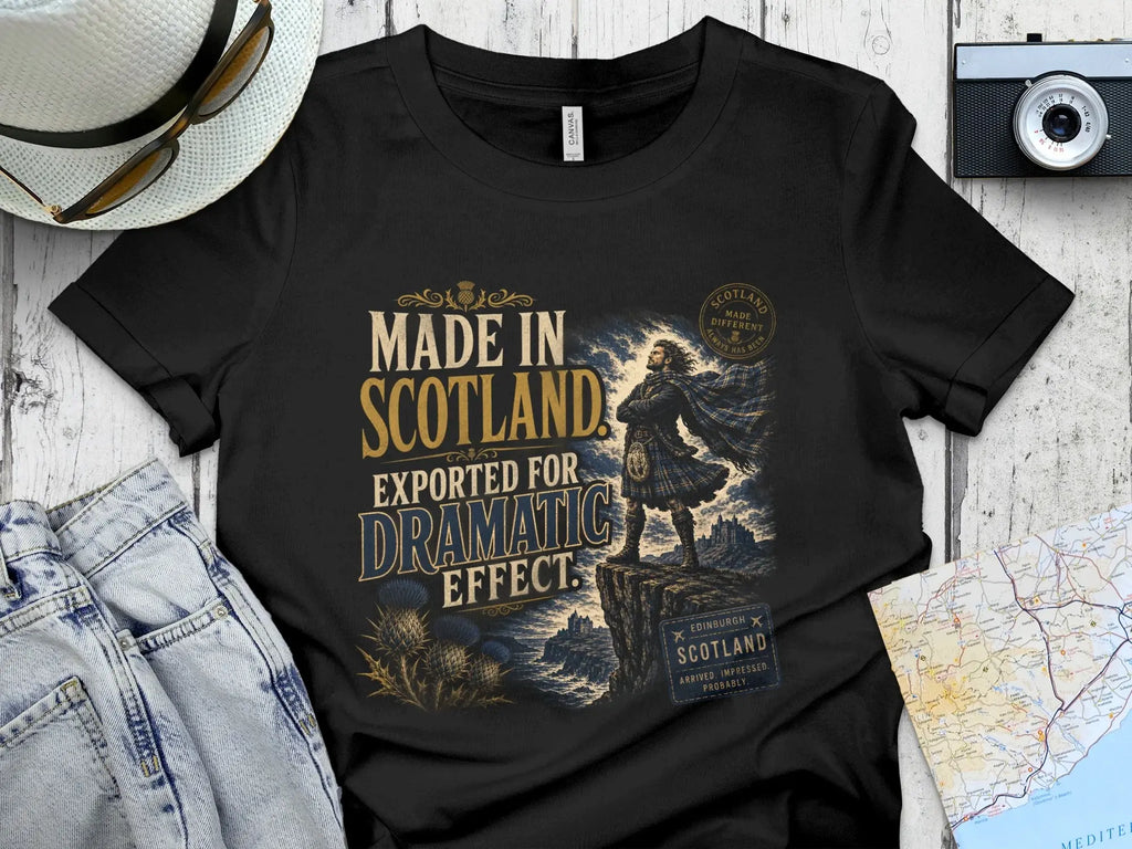 Black t-shirt with "Made in Scotland Exported for Dramatic Effect" slogan.