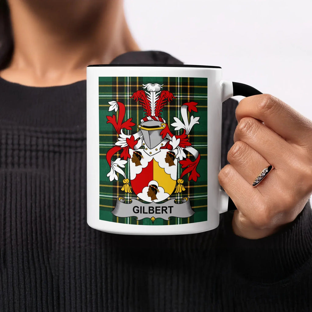 Mug with a shield displaying the Gilbert family crest on a plaid background.
