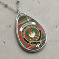 Kinnaird clan Scottish tartan necklace with clan crest on tartan background