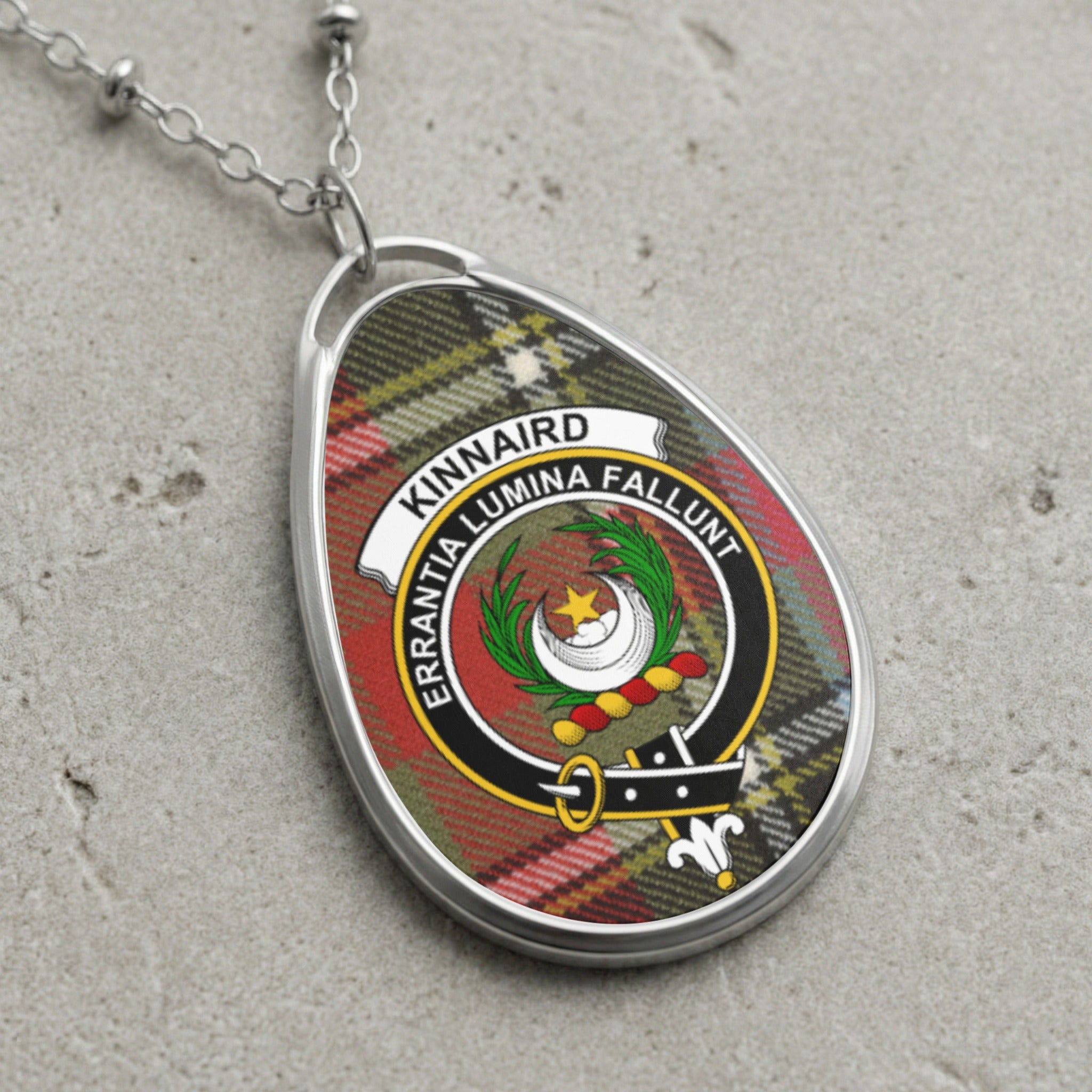 Kinnaird clan Scottish tartan necklace with clan crest on tartan background
