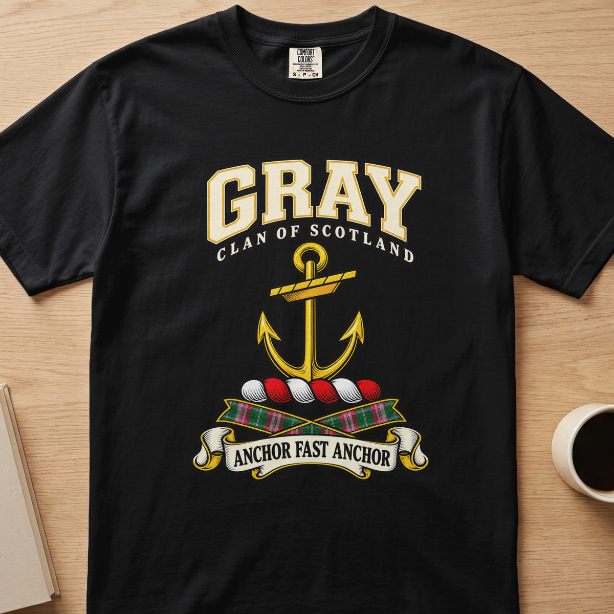 Gray clan crest with gold anchor on a black Comfort Colors T-shirt, front view