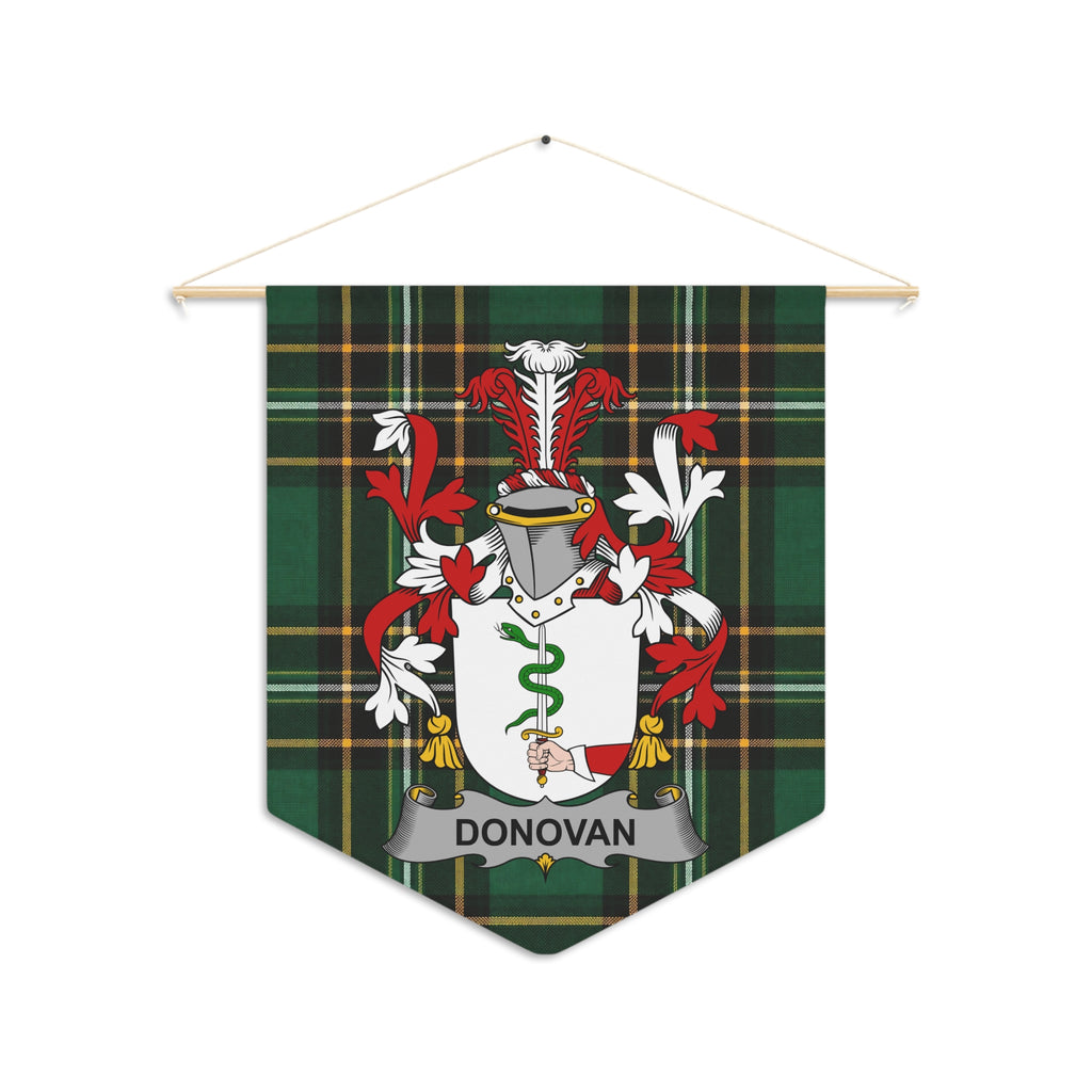 Donovan family crest on green plaid pennant hanging from wooden dowel.