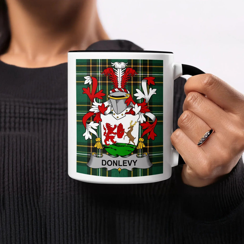 Mug with Donlevy coat of arms on a plaid background.