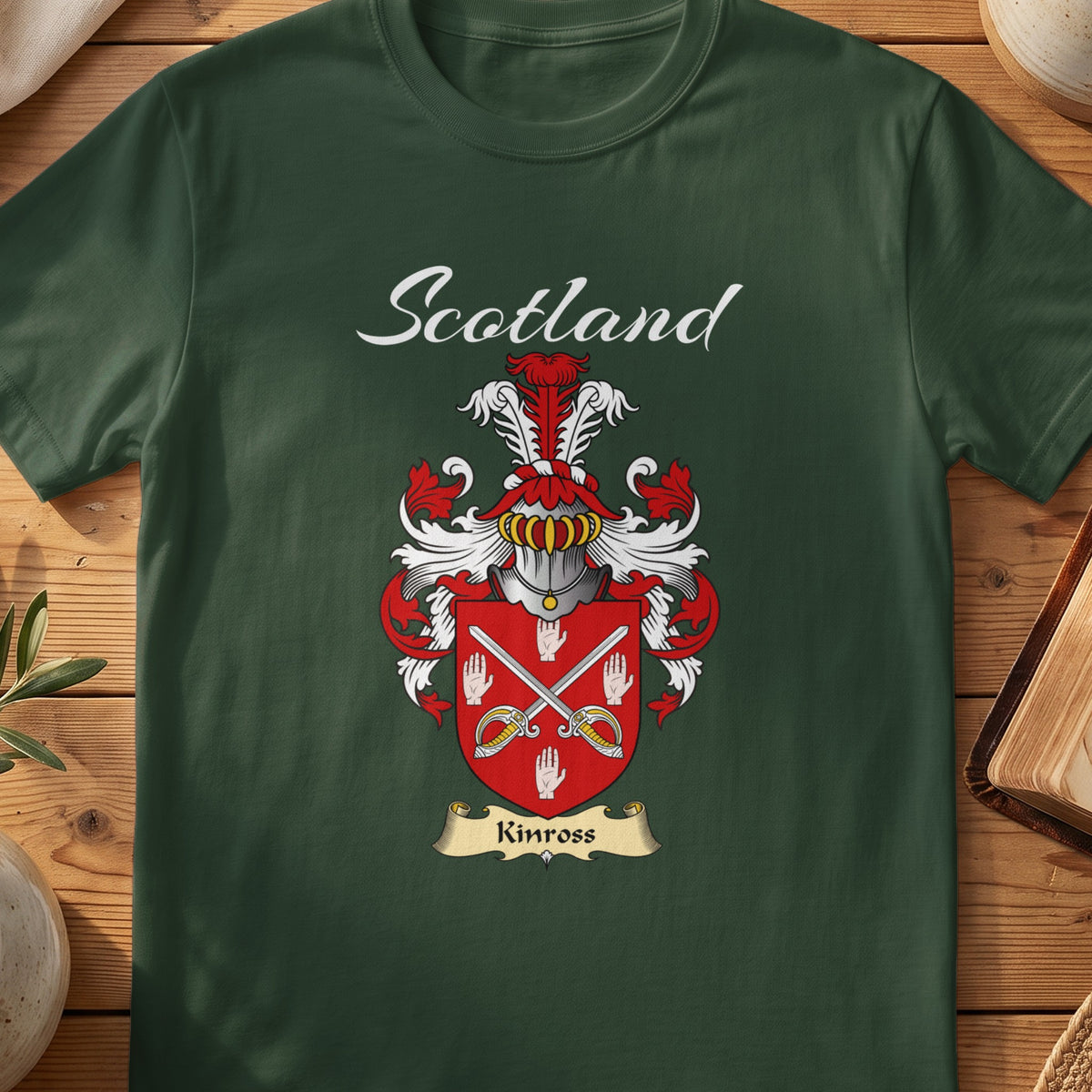 Forest Green Kinross Scottish T-shirt featuring crossed blades and white hand motifs on red