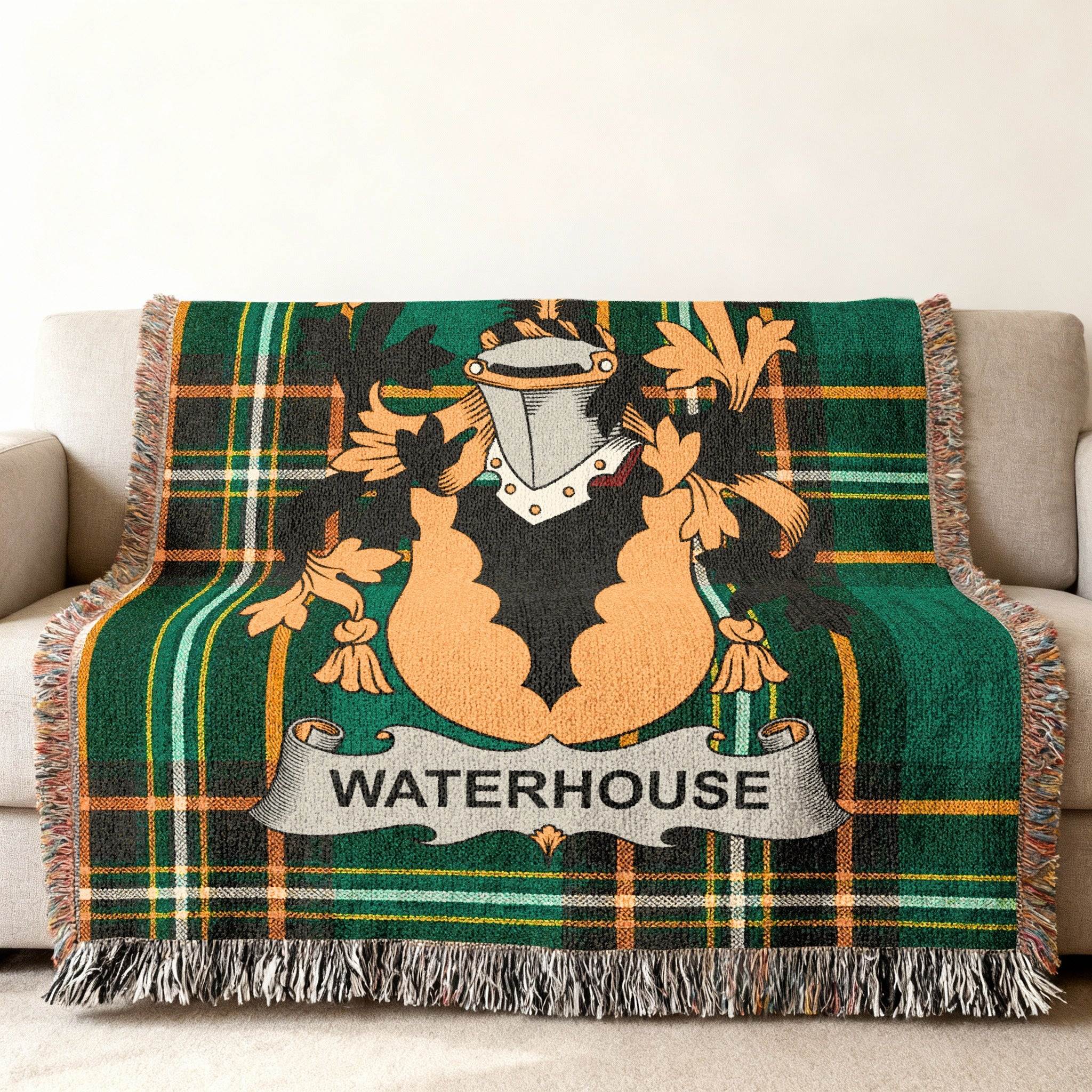 Green tartan blanket with "WATERHOUSE" crest draped over a sofa.