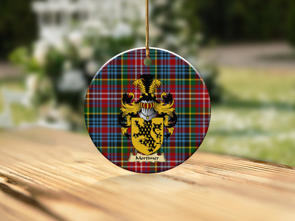 Round Mortimer Scottish clan ornament with family crest on a Caledonia tartan background