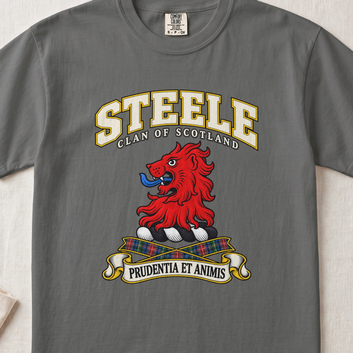 Steele Scottish clan T-shirt in Pepper, front view with a red lion head and motto design.